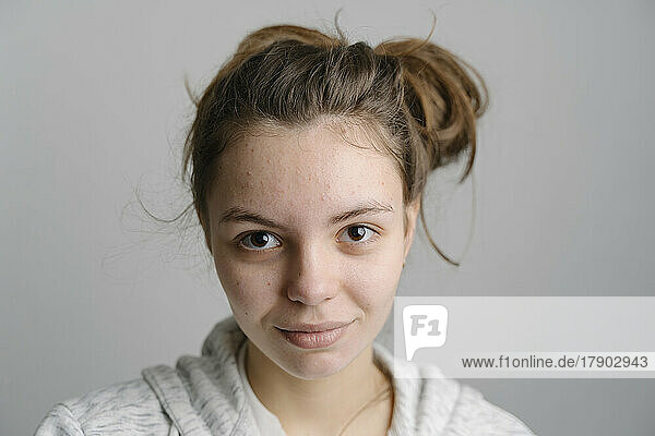 Young woman with messy bun