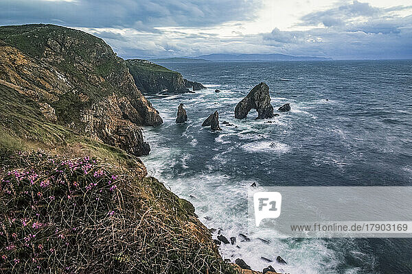 Crohy Head Sea Arch amidst waves at sunset  County Donegal  Ireland