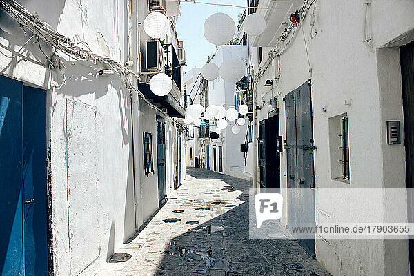 Spain  Balearic Islands  Ibiza  Paper spheres decorating empty alley