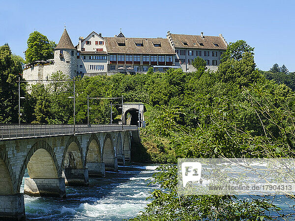 Switzerland  Canton of Zurich  Arch Bridge stretching over river Rhine with Laufen Castle in background
