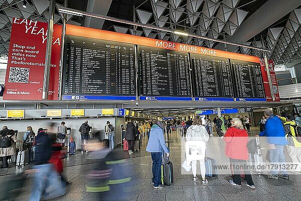 Frankfurt Airport  Fraport  Terminal 1 departure hall  passengers under a display panel  Frankfurt am Main  Hesse  Germany  Europe