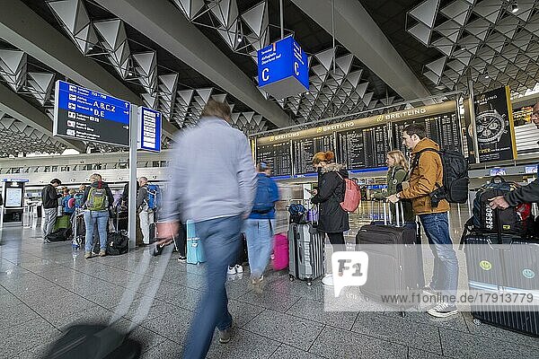 Frankfurt Airport  Fraport  Passengers waiting at check-in counters  Departure Hall C  Terminal 1  Frankfurt am Main  Hesse  Germany  Europe