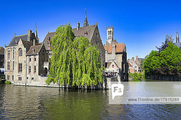 Famous canal of Rozenhoedkaai and the Belfry in the background  Bruges  UNESCO World Heritage Site  Belgium  Europe