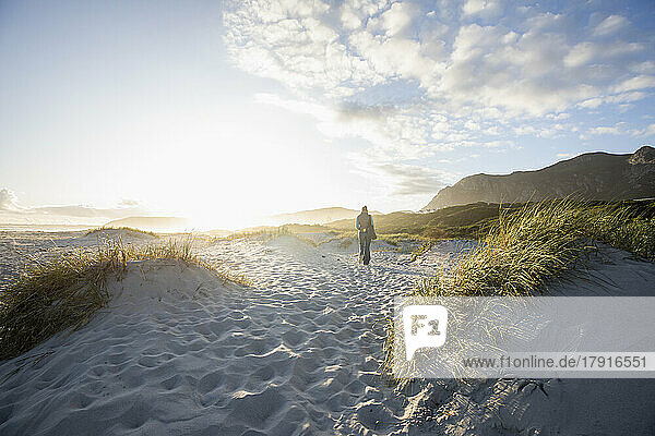 South Africa  Gansbaai  De Kelders  Woman exploring sand dunes on Grotto Beach