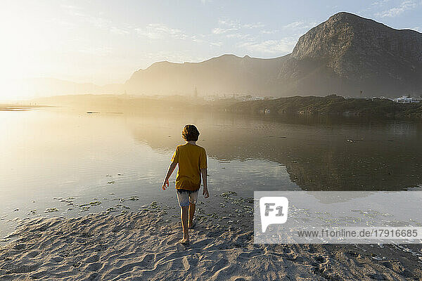 South Africa  Hermanus  Boy (8-9) exploring Grotto Beach