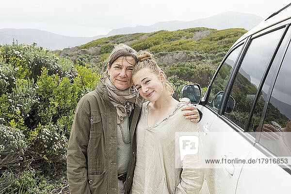 Portrait of mother and teen daughter (16-17) in Walker Bay Nature Reserve