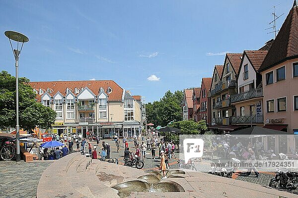 Market place with houses  people and fountain  Hattersheim  Taunus  Hesse  Germany  Europe