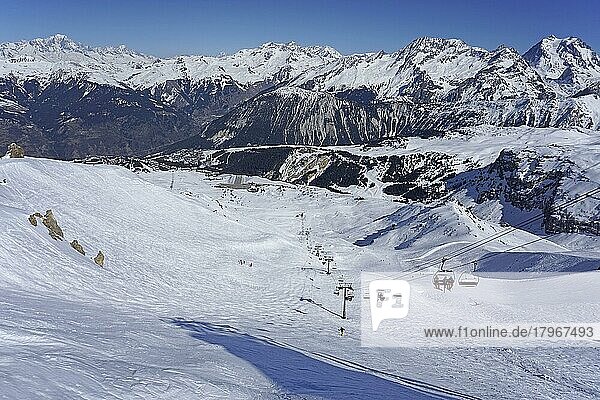 View of ski slope  ski lift  airfield  snow-capped mountains  3 Trois Vallees ski resort  Courchevel  Haute Savoie  High Savoie  France  Europe