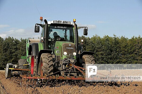 Fendt tractor 716 with stone picker  driving over newly ploughed field  England  United Kingdom  Europe