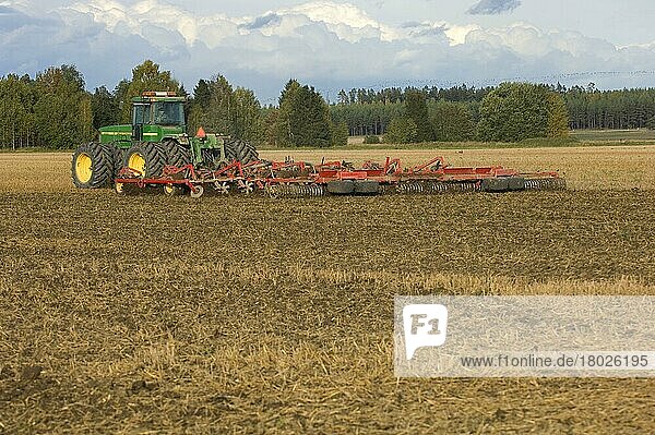 John Deere 9400 tractor  harrow stubble field  Sweden  Europe