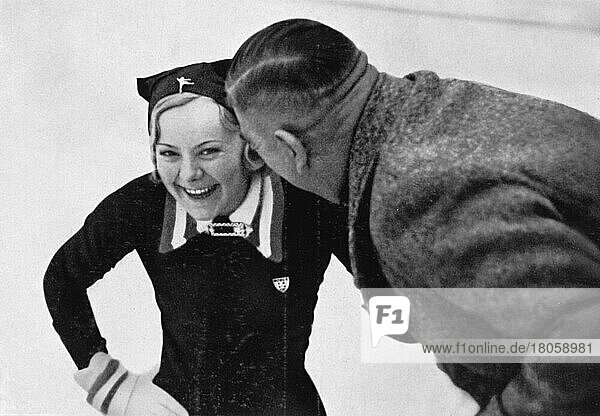 Ice figure skating  Olympic champion Sonja Heine  Norway  laughing  German veteran Arthur Viereck surely made another good joke  gold medallist  Europe