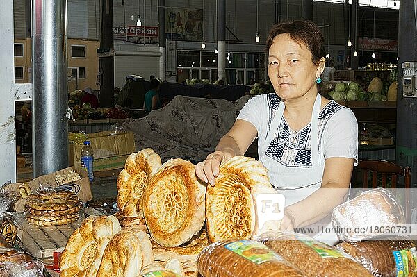Kazakh woman selling bread  Samal Bazar  Shymkent  South region  Kazakhstan  Central Asia  For editorial use only  Asia
