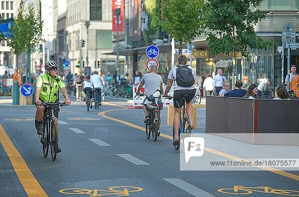Police officer  bicycle  cyclist  car-free Friedrichstraße  Mitte  Berlin  Germany  Europe