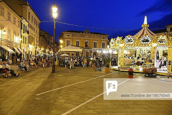 Piazza Matteotti  square  evening  night  people  carousel  Sarzana  province of La Spezia  Liguria  Italy  Europe
