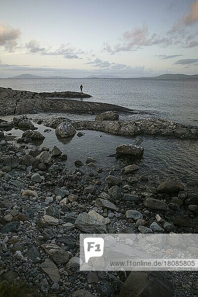 Man fishing along Wild Atlantic way at Renvyle. County Galway  Ireland  Europe