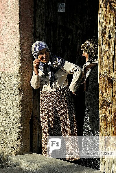 Women in front door  headscarf  Güzelyurt  Cappadocia  Turkey  Asia