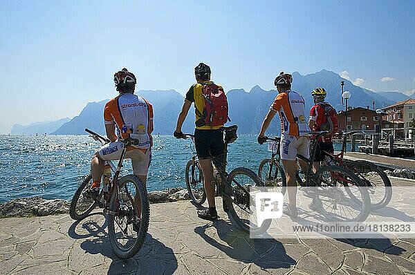 Cyclists on the promenade of Torbole  Lake Garda  Trentino  Italy  Europe