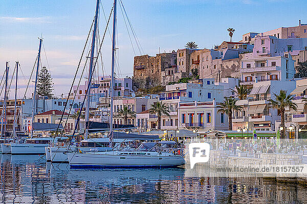 Dusk with yachts moored at the harbour waterfront in Naxos Town  Naxos  the Cyclades  Aegean Sea  Greek Islands  Greece  Europe