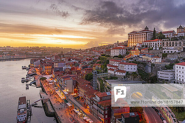 View of Douro River and The Ribeira district from Dom Luis I bridge at sunset  UNESCO World Heritage Site  Porto  Norte  Portugal  Europe