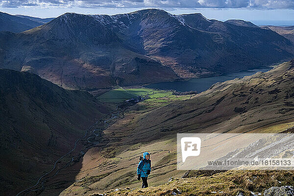 Female walker on Dale Head above Honister Pass and Buttermere Valley  Lake District National Park  UNESCO World Heritage Site  Cumbria  England  United Kingdom  Europe