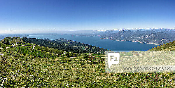 Idyllic view of Lake Garda under blue sky on sunny day