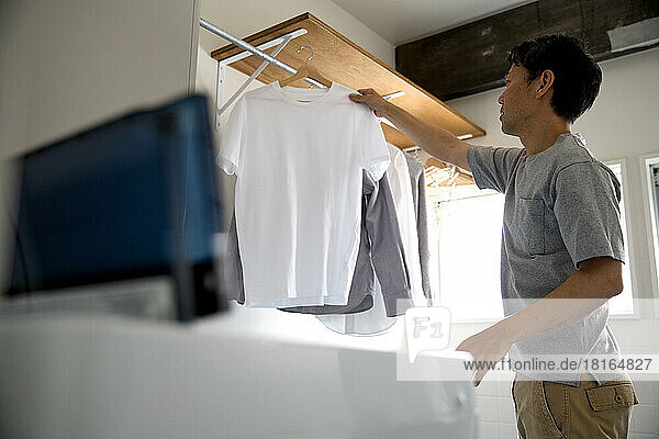 Japanese man doing laundry