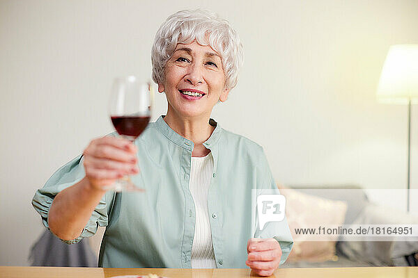 Japanese senior woman drinking red wine