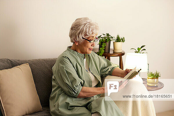 Japanese senior woman reading a book