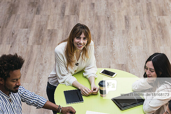 Portrait of a smiling businesswoman in a meeting in office