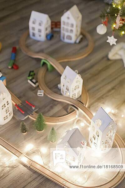 Wooden toy rail track with string light by Christmas decoration at home