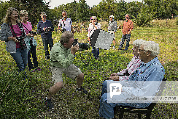 An elderly man and woman pose for a photo workshop; Bennet  Nebraska  United States of America