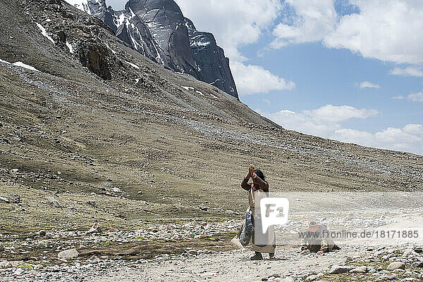 Pilgrims starting on the Kora pilgrimage and prostrating on Mount Kailash; Tibetan Autonomous Region  Tibet