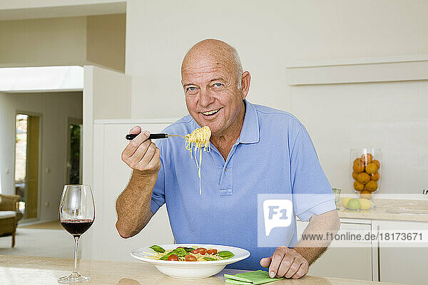 Portrait of Man Eating Spaghetti