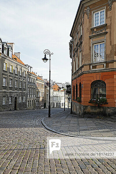 Old buildings and lamp post on cobblestone street corner  Old Town  Warsaw  Poland.