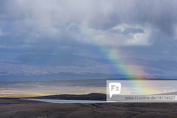Rainbow over the Highlands landscape on the Isle of Skye in Scotland  United Kingdom