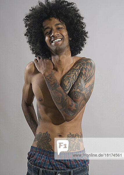 Portrait of Young Man with Tattoos  Studio Shot