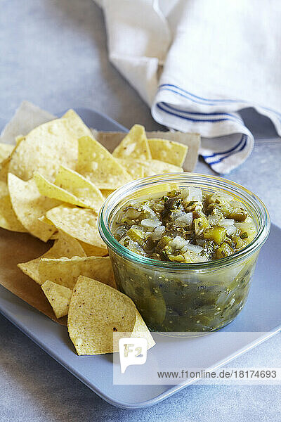Tomatillo salsa served with corn tortilla chips