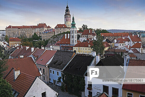 Overview of city and rooftops with the tower of St Jost Church and the tower of Cesky Krumlov Castle in the background  Cesky Krumlov  Czech Replublic.