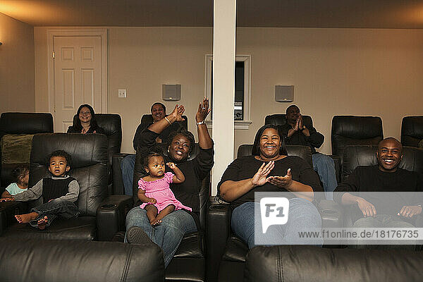 Extended Family Watching Movie in Home Theater