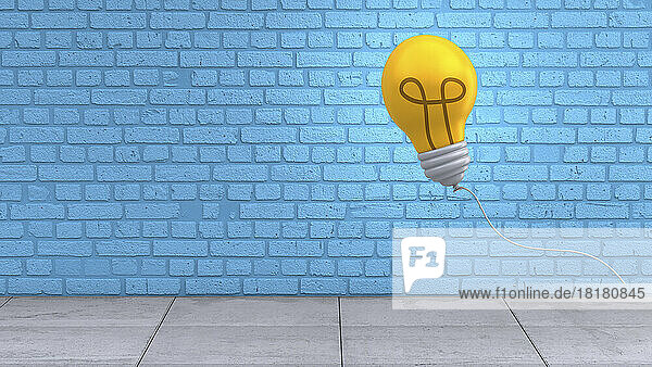 Three dimensional render of light bulb floating against blue brick wall