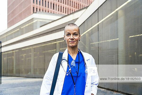 Mature female doctor with shaved head