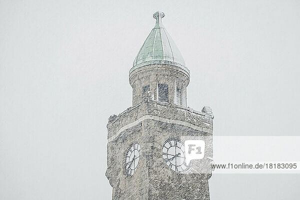 Germany  Hamburg  Pegelturm clock tower during snowfall
