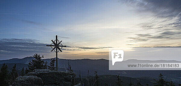 Germany  Bavaria  Panoramic view of summit cross on Zwercheck mountain at dusk