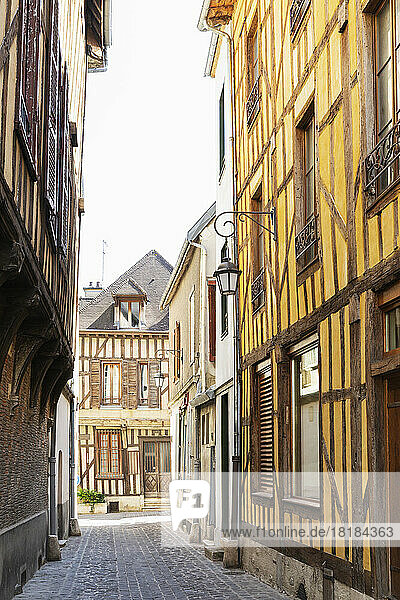 France  Grand Est  Troyes  Alley between historic half-timbered townhouses