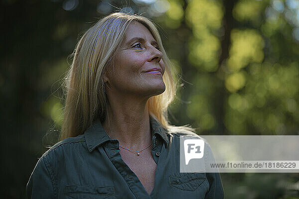 Smiling mature woman in garden