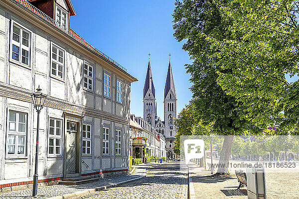Germany  Saxony-Anhalt  Halberstadt  Cobblestone street with Halberstadt Cathedral in background