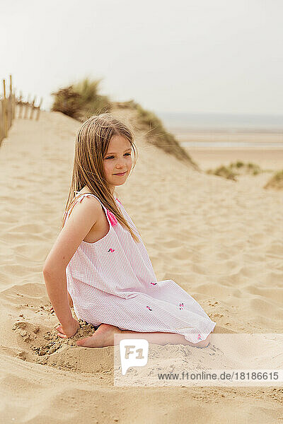 Portrait of girl sitting on the beach