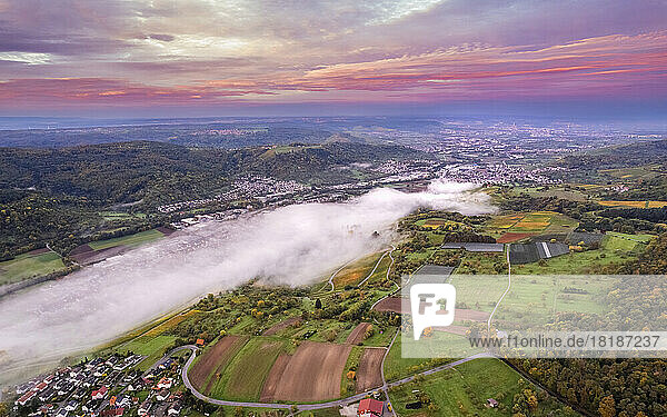 Germany  Baden-Wurttemberg  Drone view of Remstal valley at foggy dawn