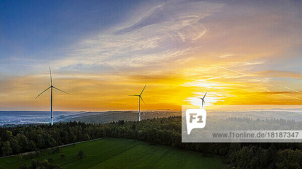 Germany  Baden-Wurttemberg  Drone view of wind farm in Remstal valley at sunrise
