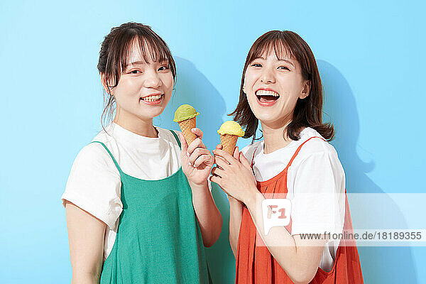 Young Japanese women eating ice cream
